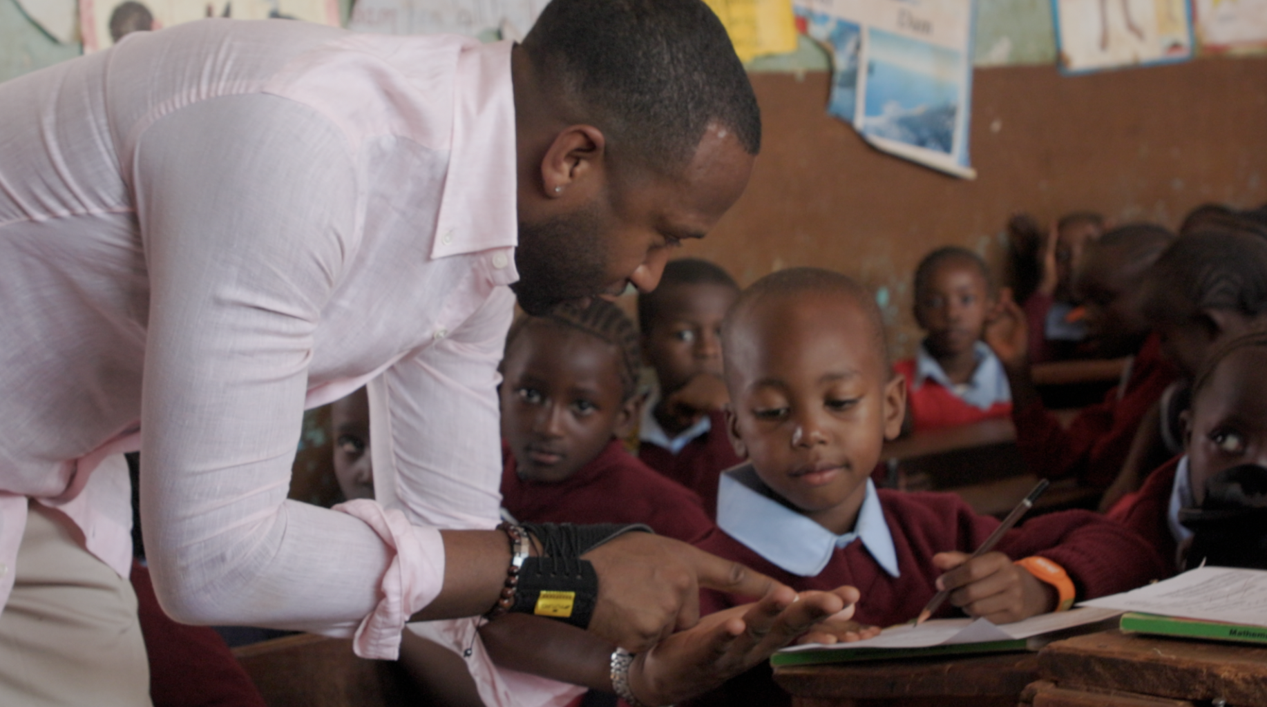 Matthew Benjamin with students in Kenya