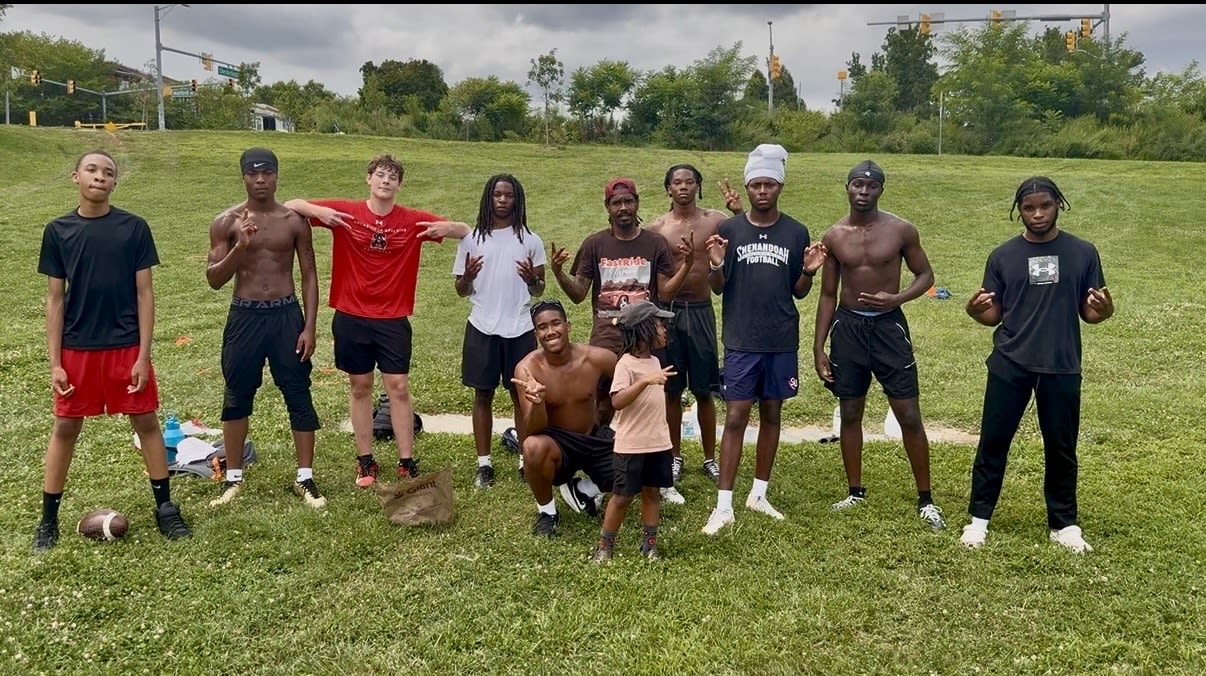 Coach Ryan with the full Back2Ballin team on the field