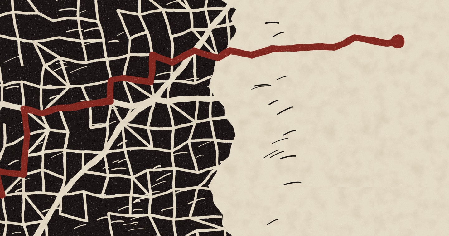 A street map carved in a black block on the left gives way to bare paper, crossed by a single red route.
