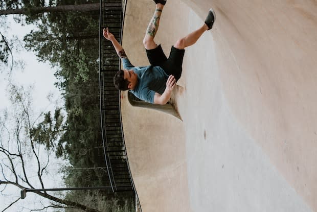 a man falling down at a skate park