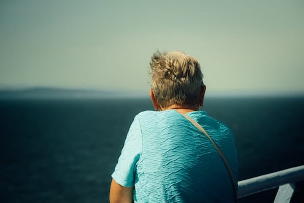 an older woman looking out to the ocean