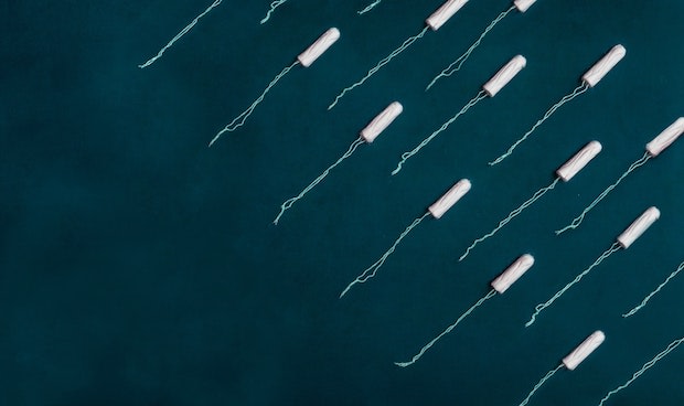 tampons arranged on a green background