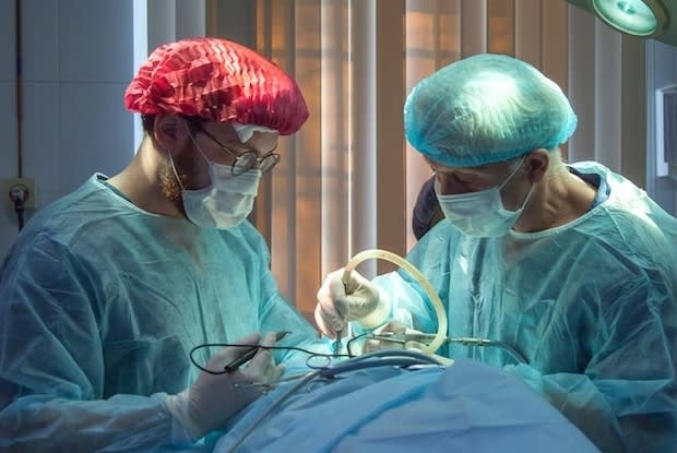 Surgeons performing a lung transplant