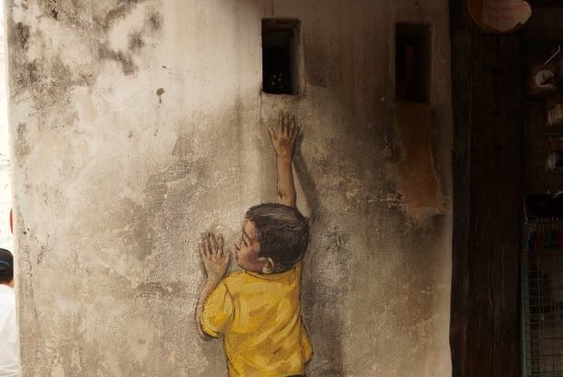 image of a child drawn on a wall