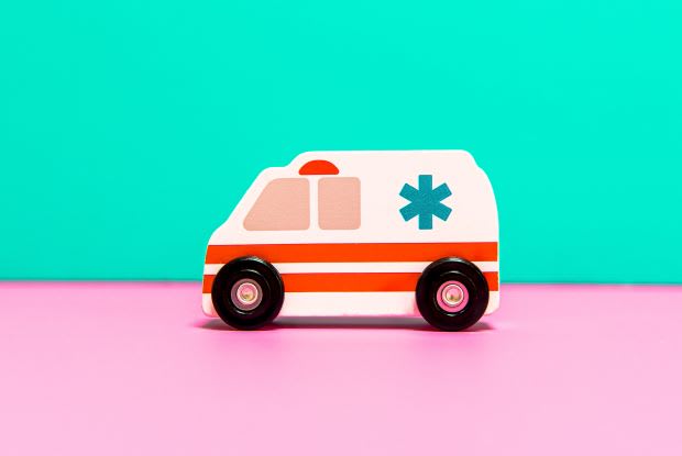 a toy figure of an ambulance vehicle