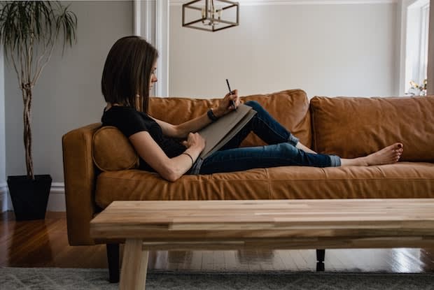 a woman sitting on a couch