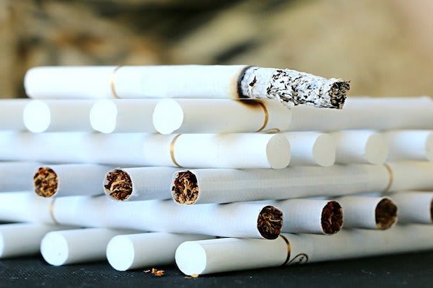 cigarettes stacked on top one another