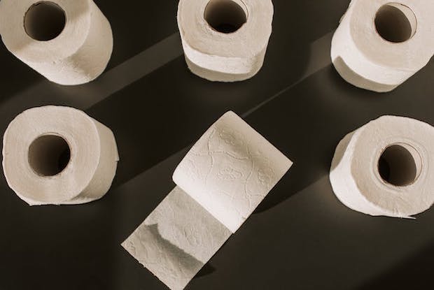 Toilet rolls on a black background