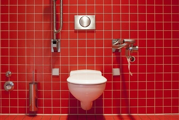 a red-tiled restroom