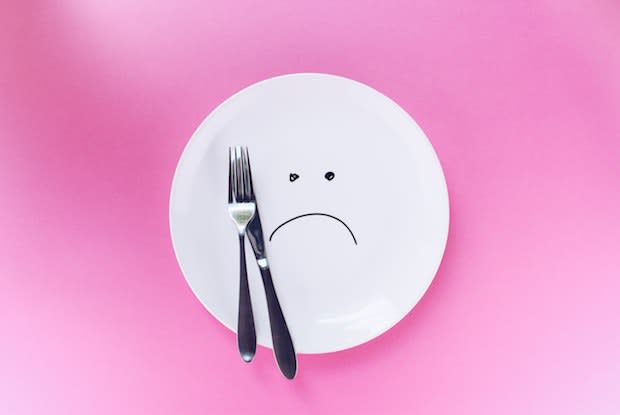 a plate with a sad face