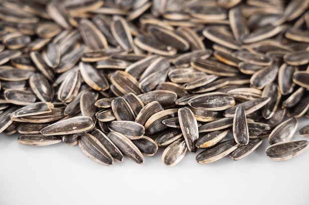 sunflower seeds on a white table