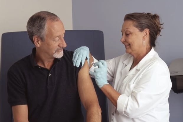 a nurse administering a shot