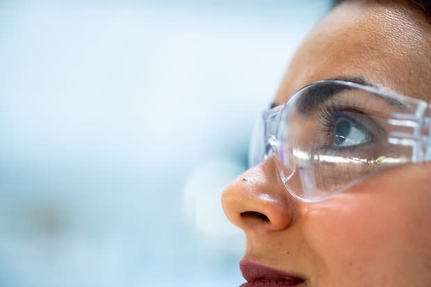 a woman wearing science goggles