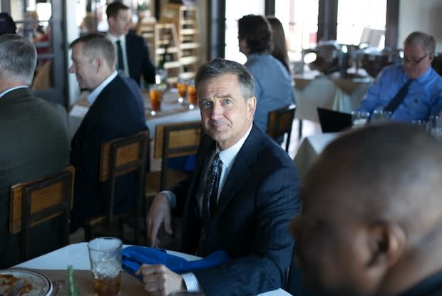 an older man in a restuarant