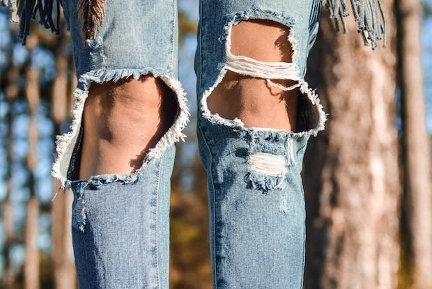 jeans with the knees exposed