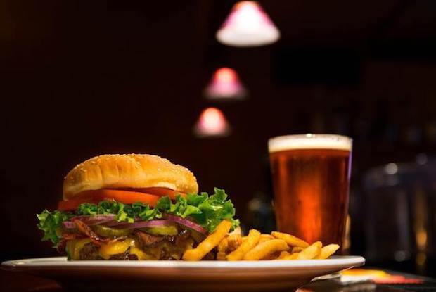 Burger, fries and a pint of alcohol