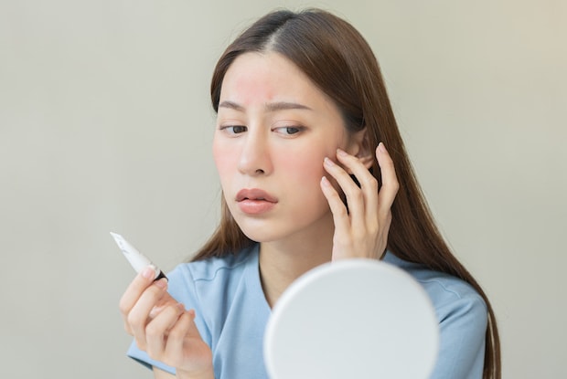 a woman looking at her reflection