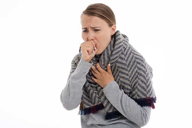 a woman coughing