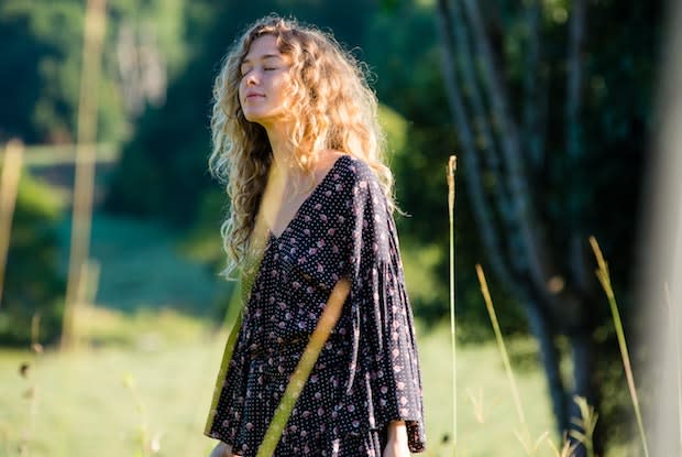 a woman breathing outside