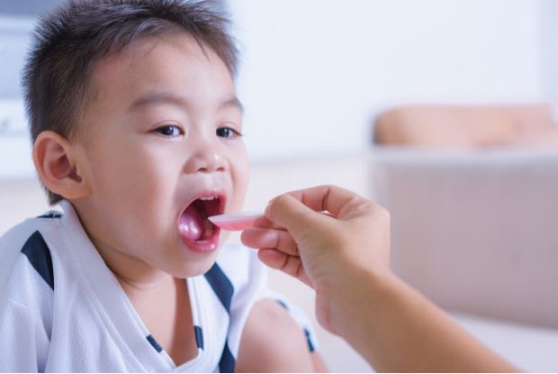 a child taking a medication