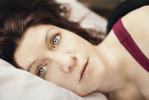 a woman awake in bed