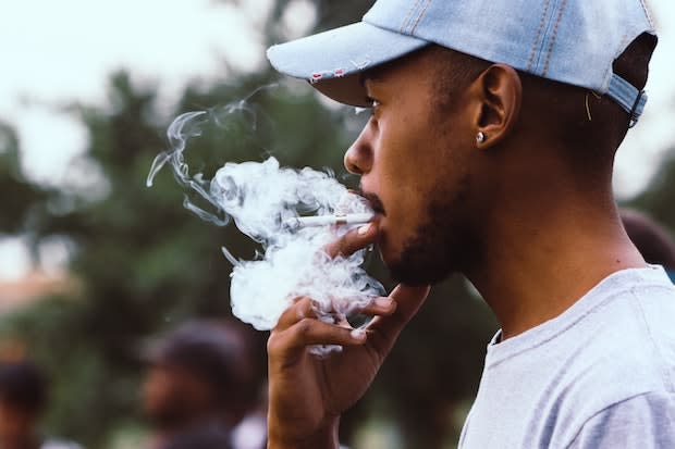 a man smoking a cigarette