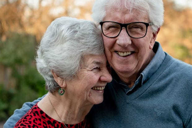 an older couple smiling