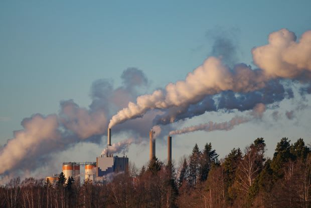 smoke stacks in the distance