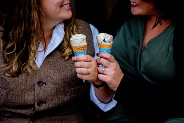 two friends enjoying ice cream cones