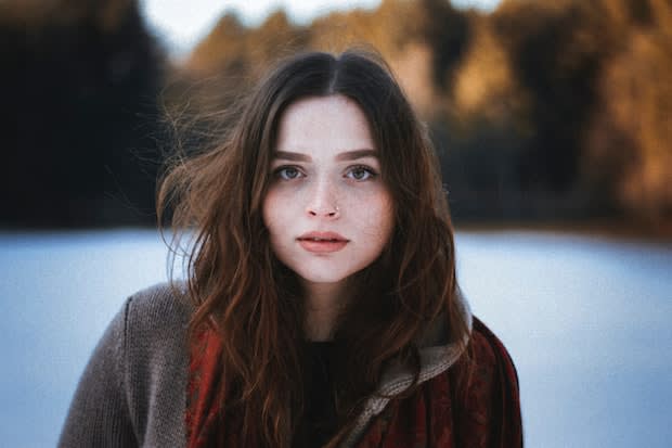 a brunette woman with pale skin