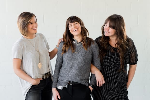 three women, laughing