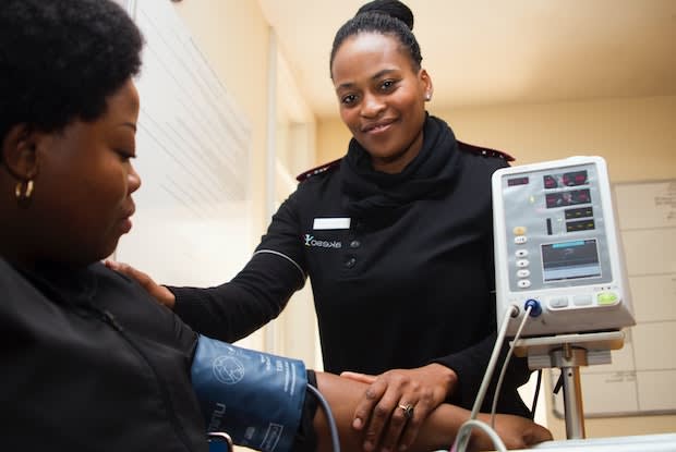 a woman having her blood pressure taken