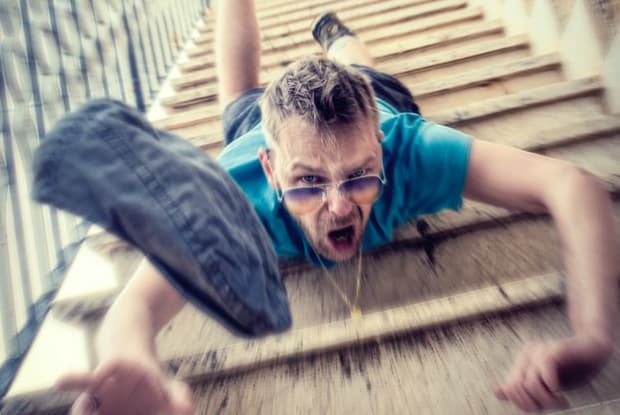 a man falling down a flight of stairs