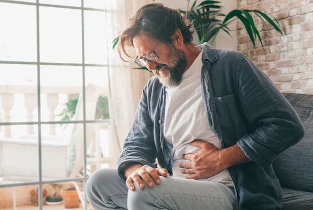 a man clutching his stomach