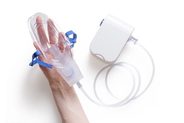 a small oxygen machine with a breathing mask