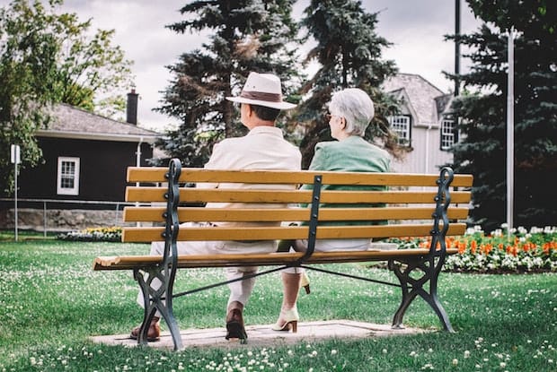 a couple sitting on a bench