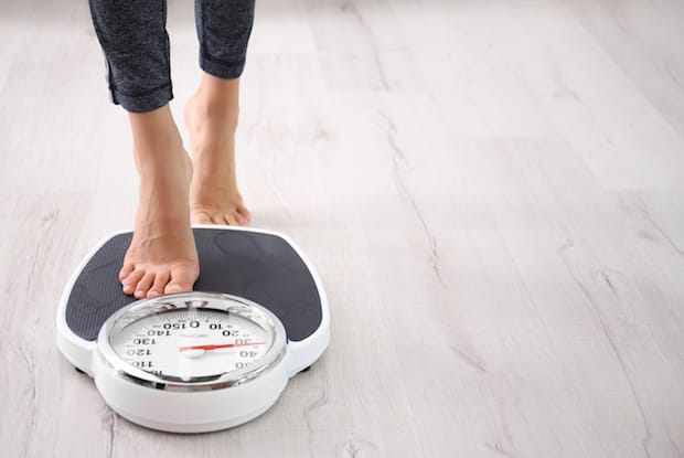 a person stepping on a scale