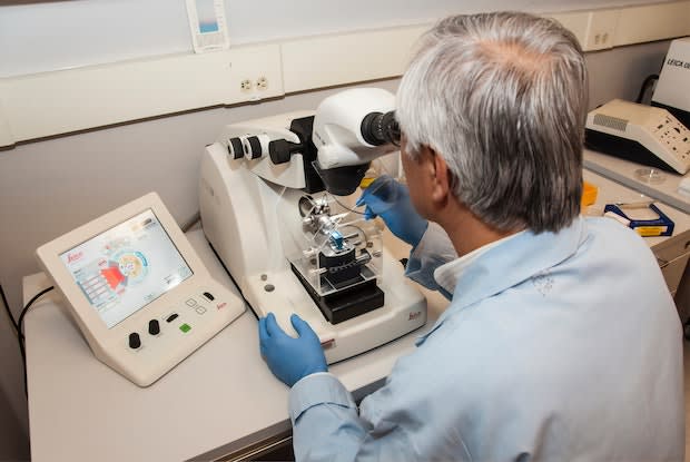 a doctor analyzing a sample