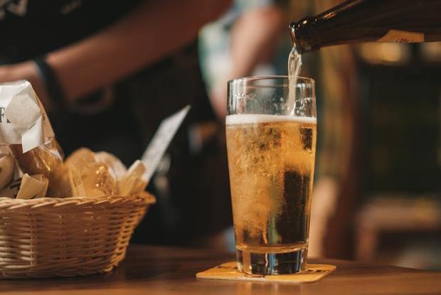 a beer being poured into a glass