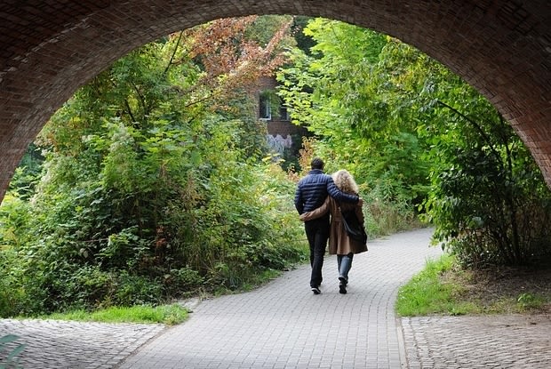 a couple walking hand in hand