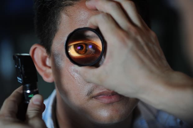 a doctor looking at a patient