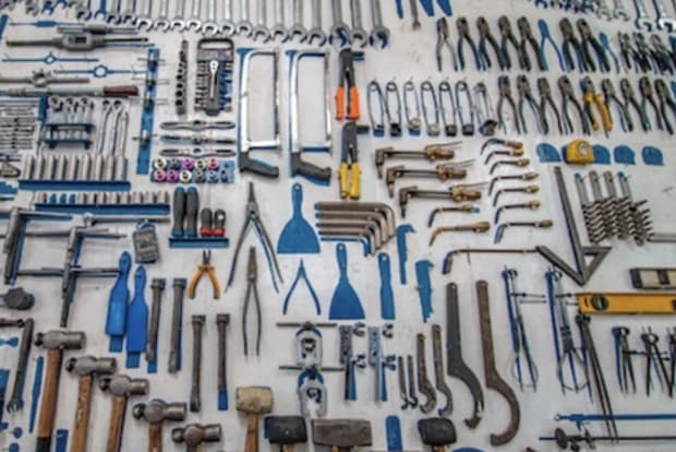 An assortment of tools lined up by size