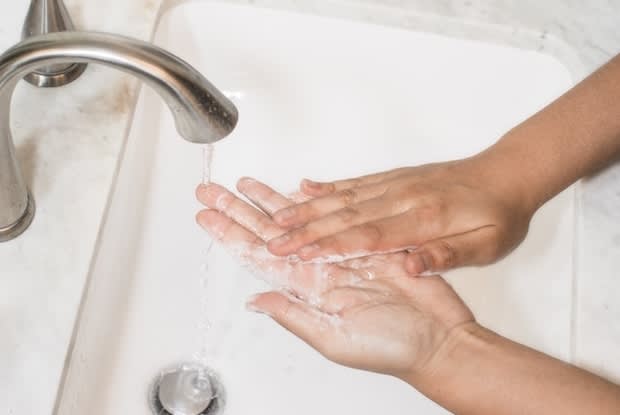 person preparing to wash their face