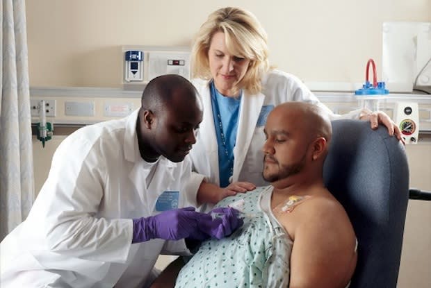 A doctor injecting medicine into a patient