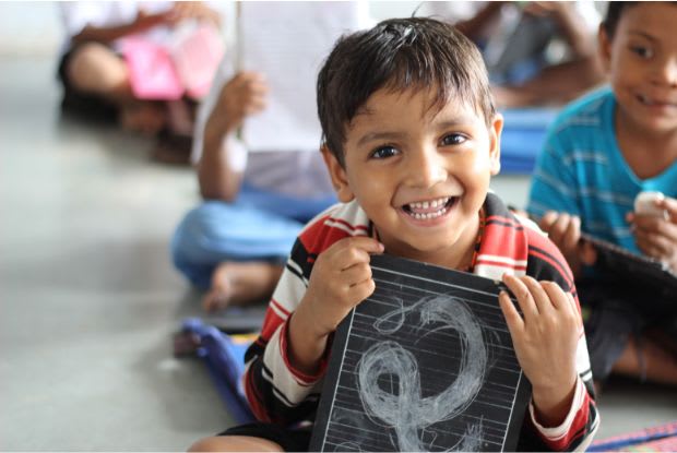 a child holding a book