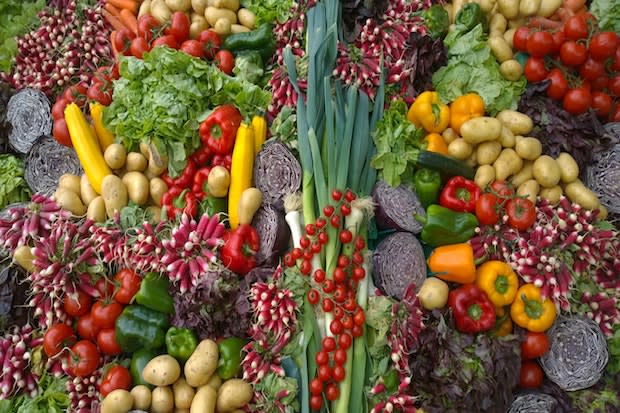 various vegetables stacked up on each other