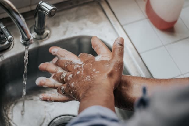 a man washing his hands