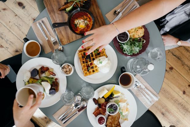 a table full of breakfast food