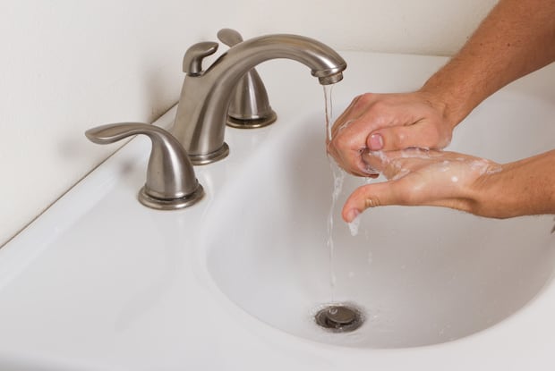 a person washing their hands