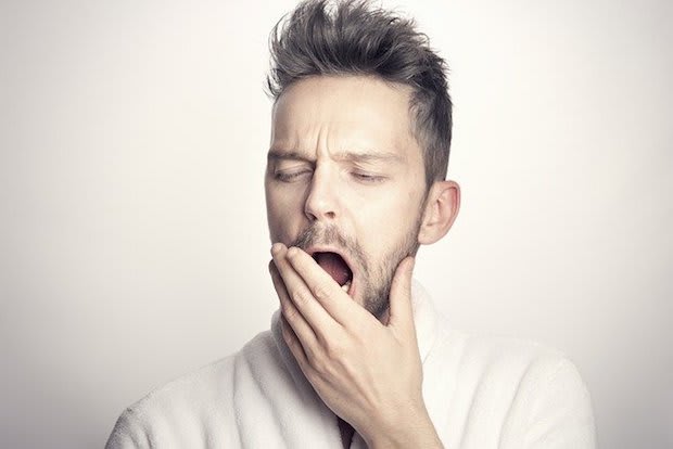 a man yawning